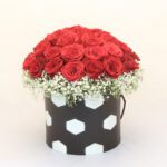 box of red roses with football design