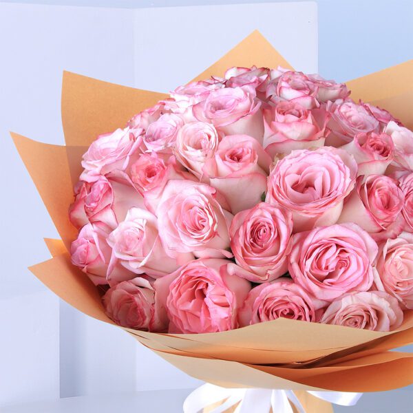A Heartfelt Gesture pink roses in brown wrap