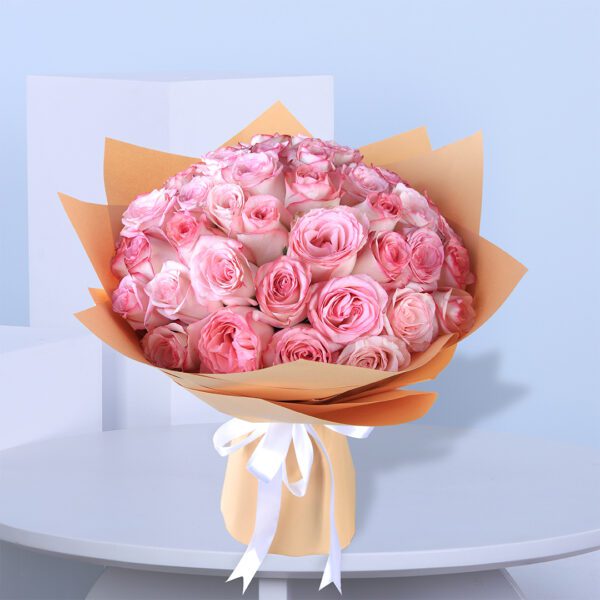 A Heartfelt Gesture1 pink roses in brown wrap