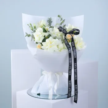 baby rose bouquet with white wrap