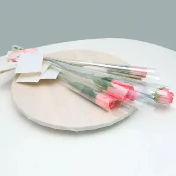 single stem light pink rose wrapped