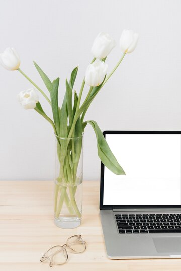 tulips in vase on the office table