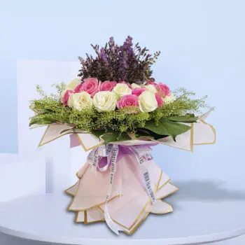 Sophisticated floral design featuring roses in soft hues, ideal for gifting or home decor.