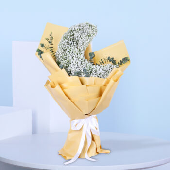 Half-moon floral arrangement featuring delicate white flowers.