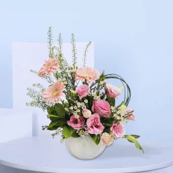 Surprise Mom with a gorgeous pink floral arrangement featuring roses, gerberas, and white accents—perfect for expressing love on Mother’s Day.