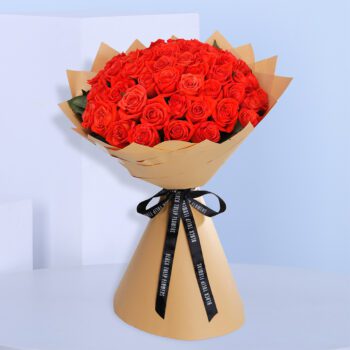 Classic bouquet of orange roses tied with a satin ribbon.