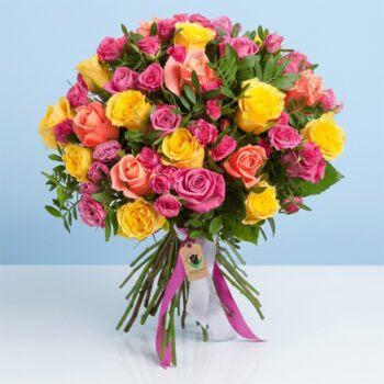 A Stunning Bouquet Featuring Pink And Yellow Roses, Elegantly Presented As A "Rose Garden Bouquet."