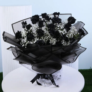 Black painted roses with baby’s breath in black luxury wrapping.